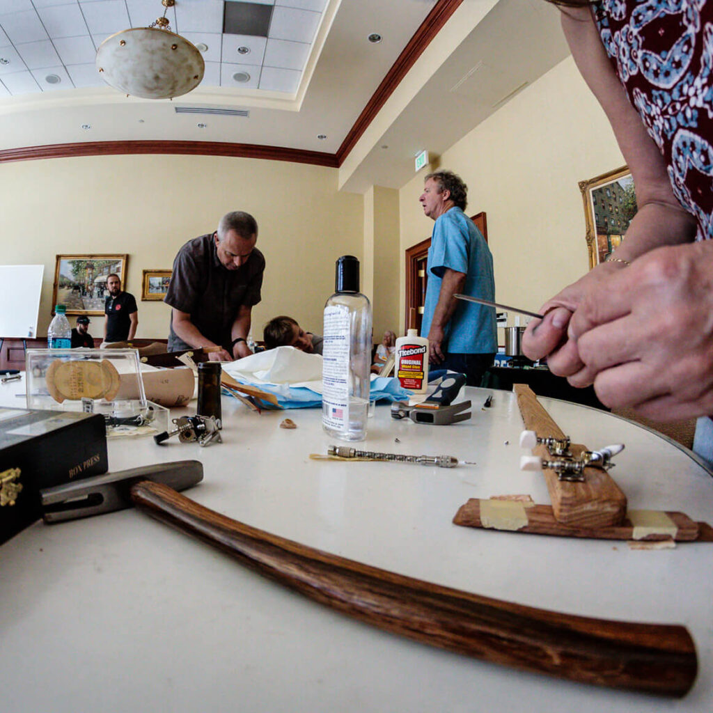 Making cigar box guitars in workshop