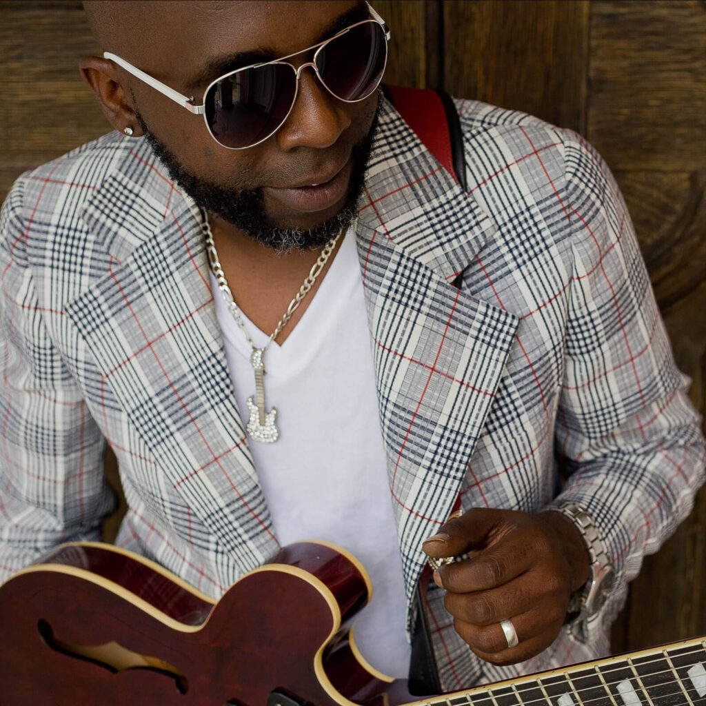 Mr. Sipp with Guitar and sun glasses
