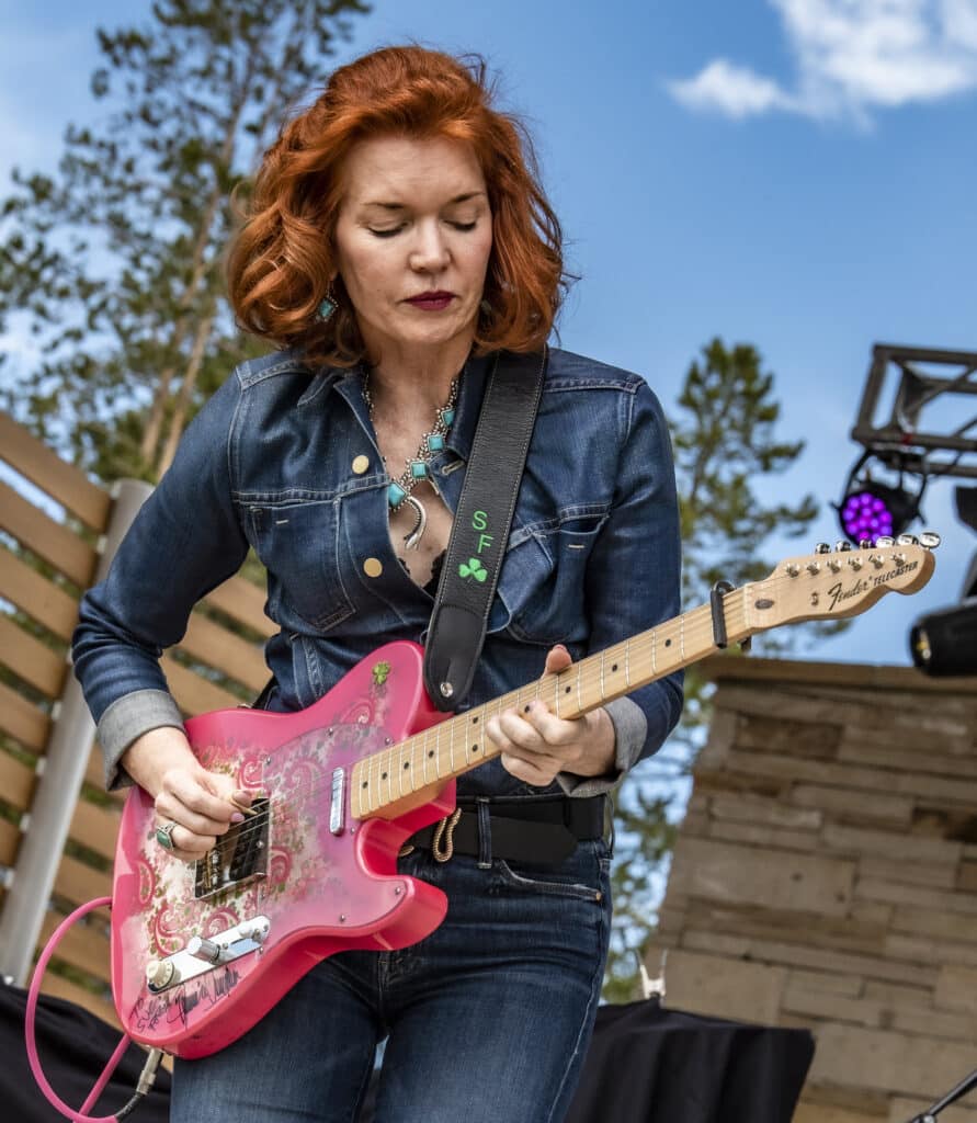 Sue Foley playing guitar on stage at Utah Blues Festival