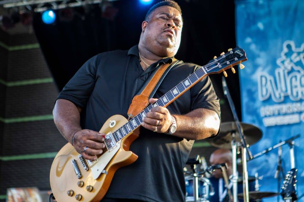 Larry McCray playing guitar on stage