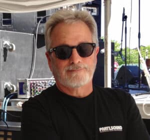 Ed Pratt in front of his sound equipment at the Utah Blues Festival
